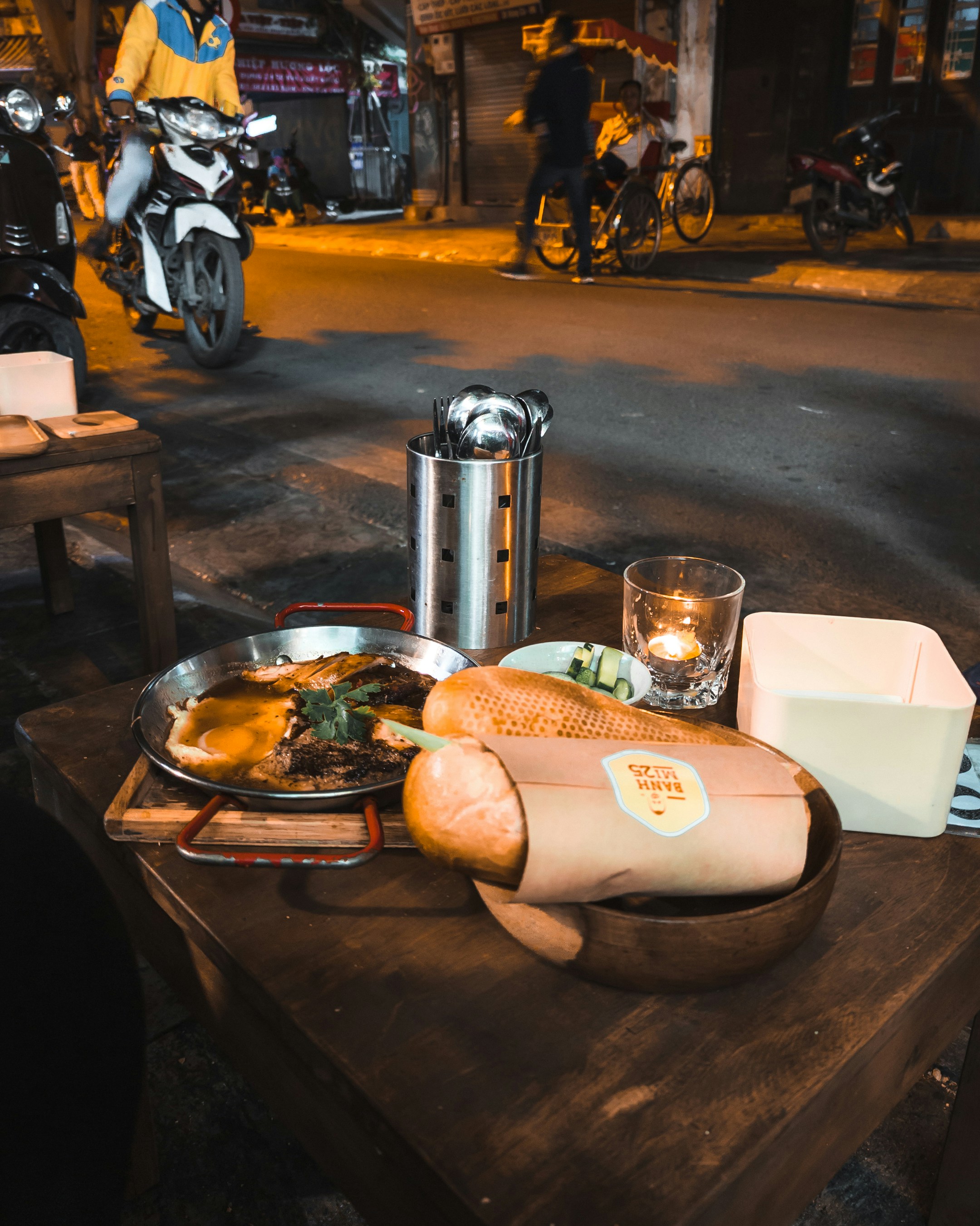 A wooden table topped with lots of food