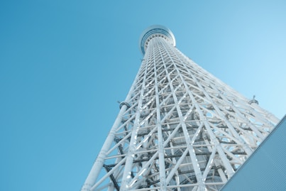 A very tall tower with a sky background