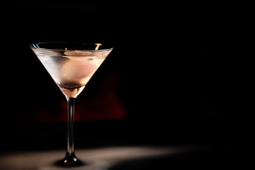 A martini glass sitting on top of a table