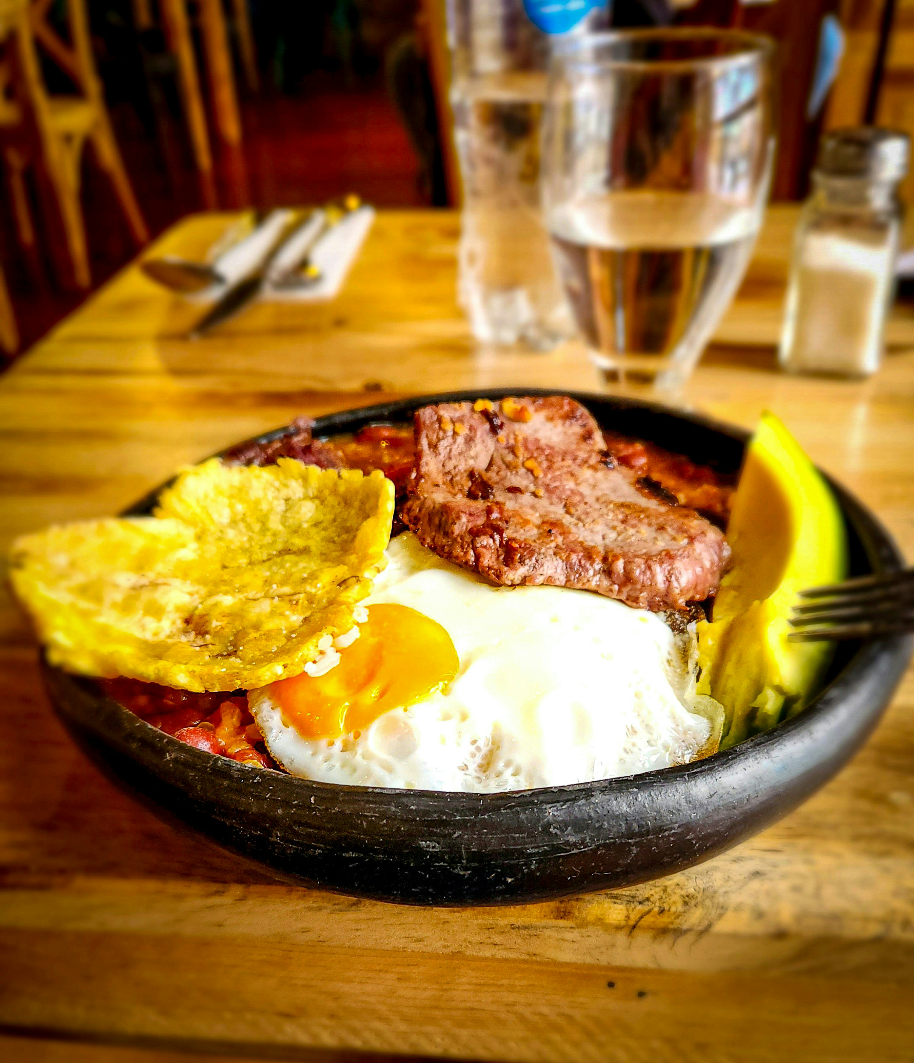 A plate of food on a wooden table