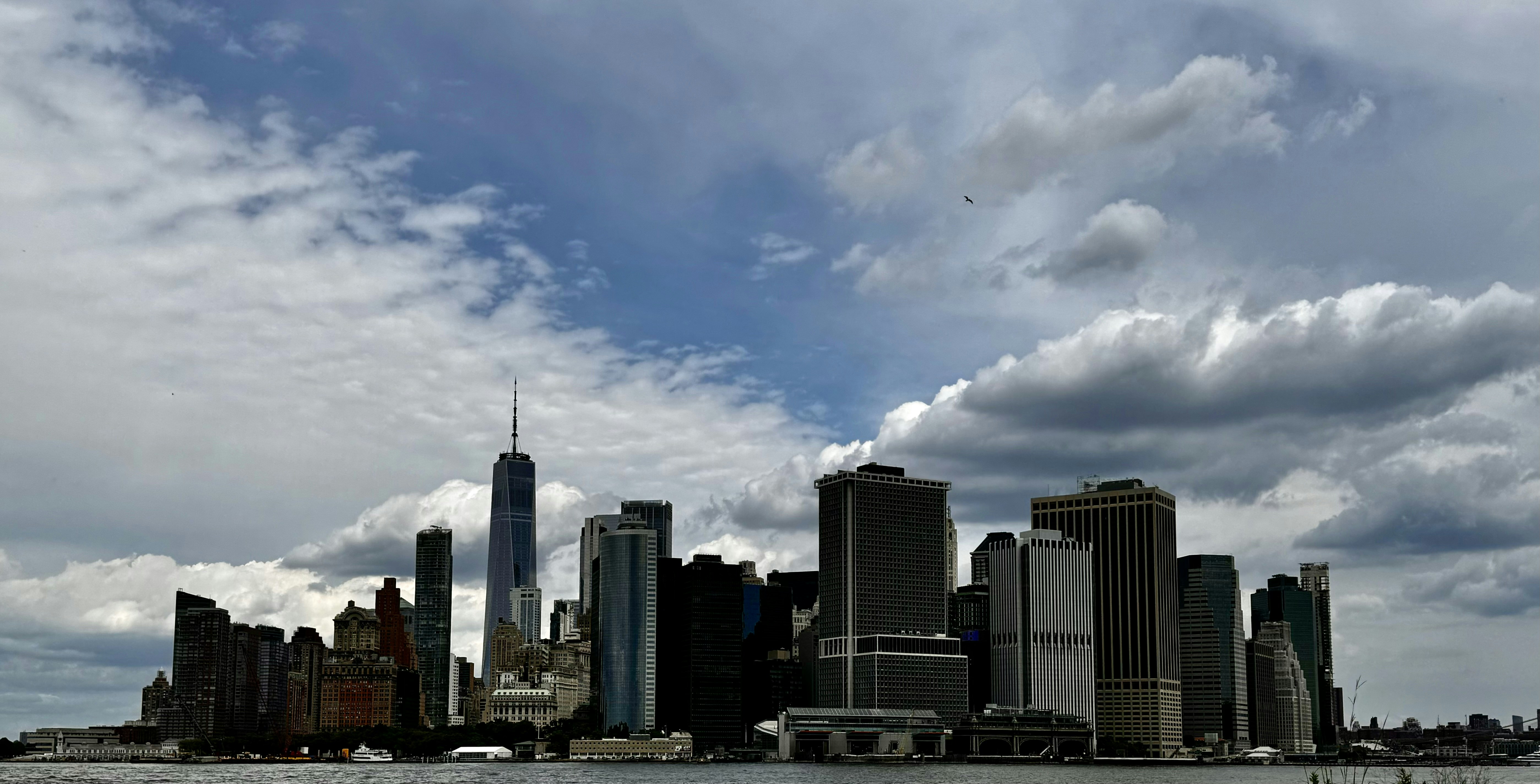 A large body of water with a city in the background