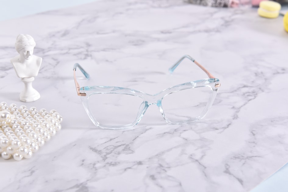 A pair of glasses sitting on top of a table
