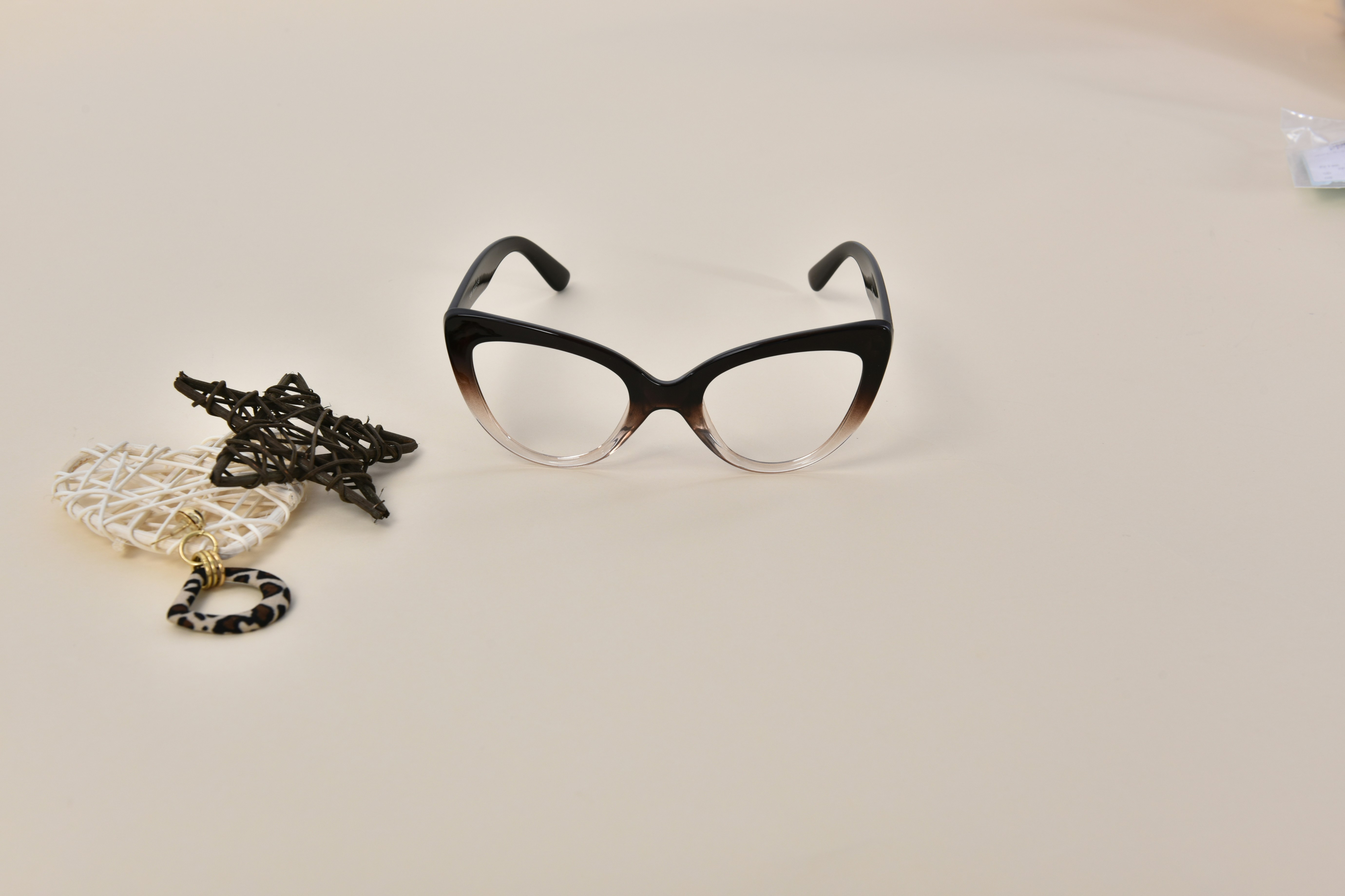A pair of glasses sitting on top of a table