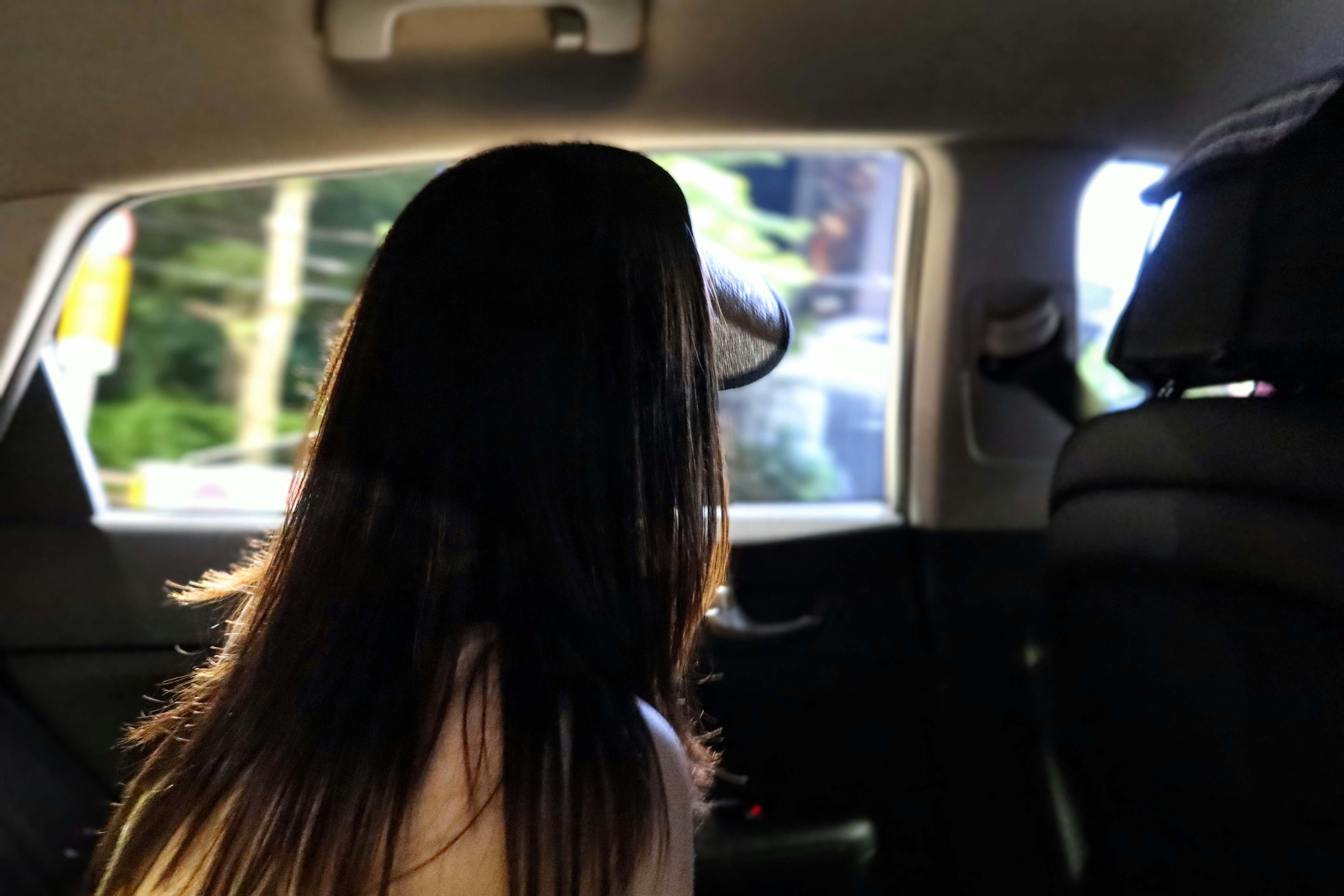 Woman sitting in back seat