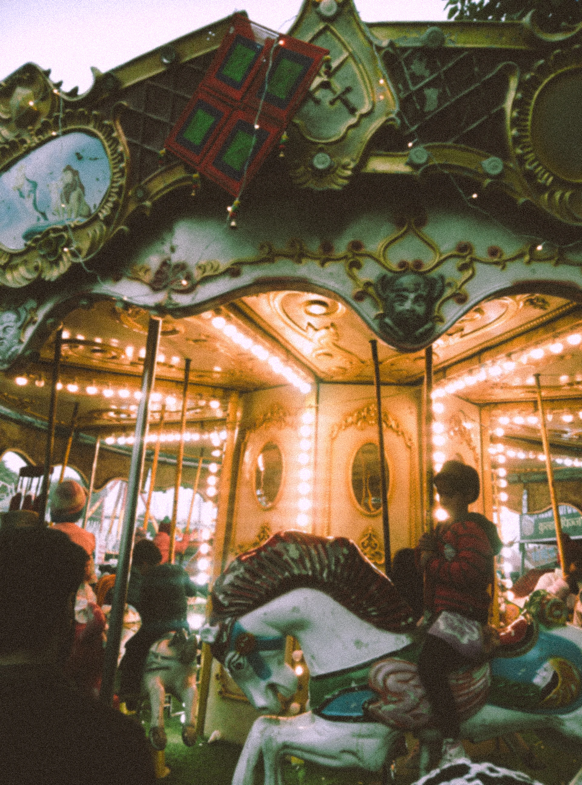 A merry go round with people on it