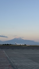 A large jetliner sitting on top of an airport tarmac