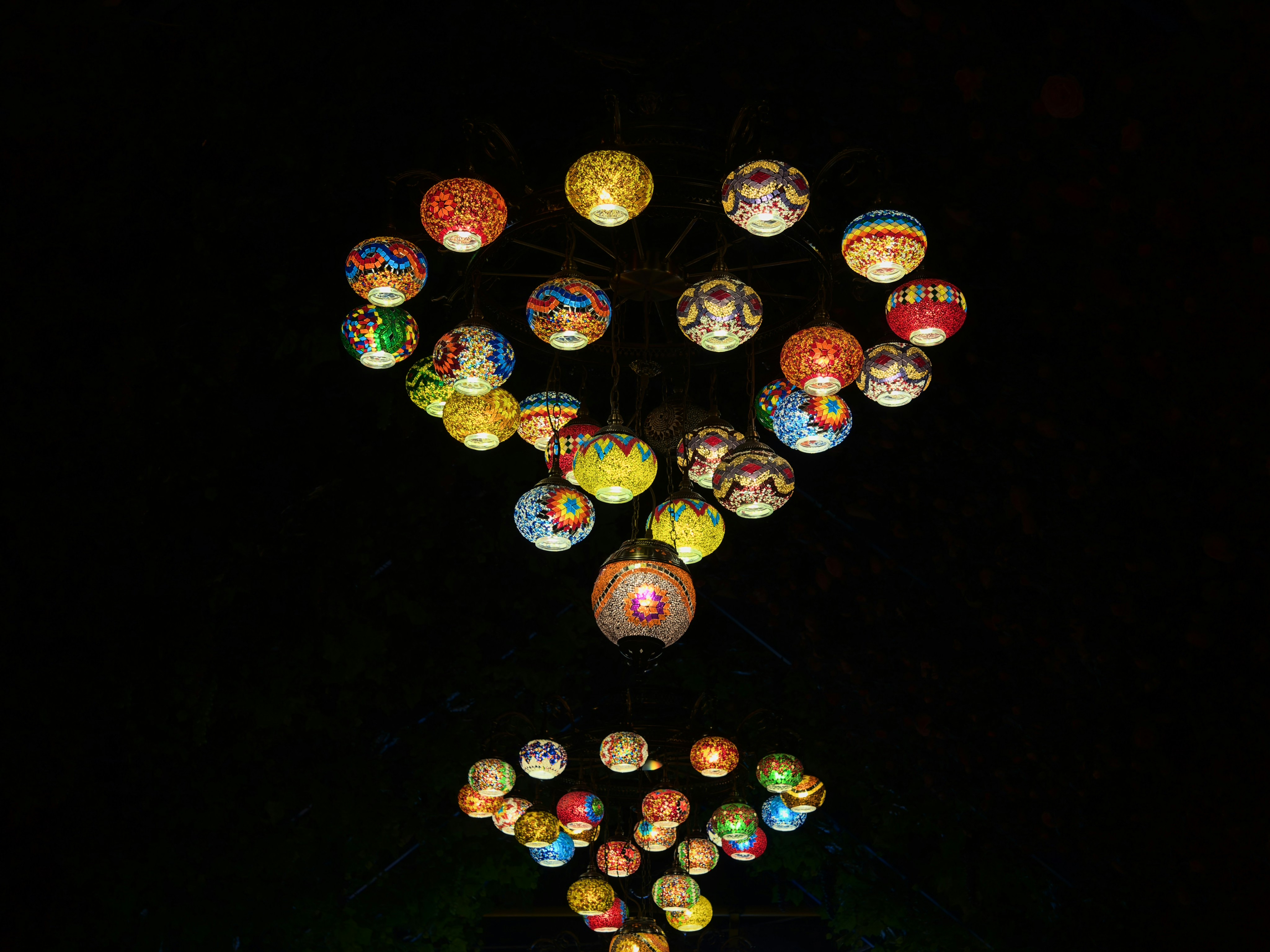 A group of colorful balls floating in the air photo – Free Lamp Image ...