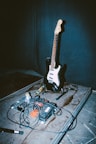 An electric guitar sitting on top of a table
