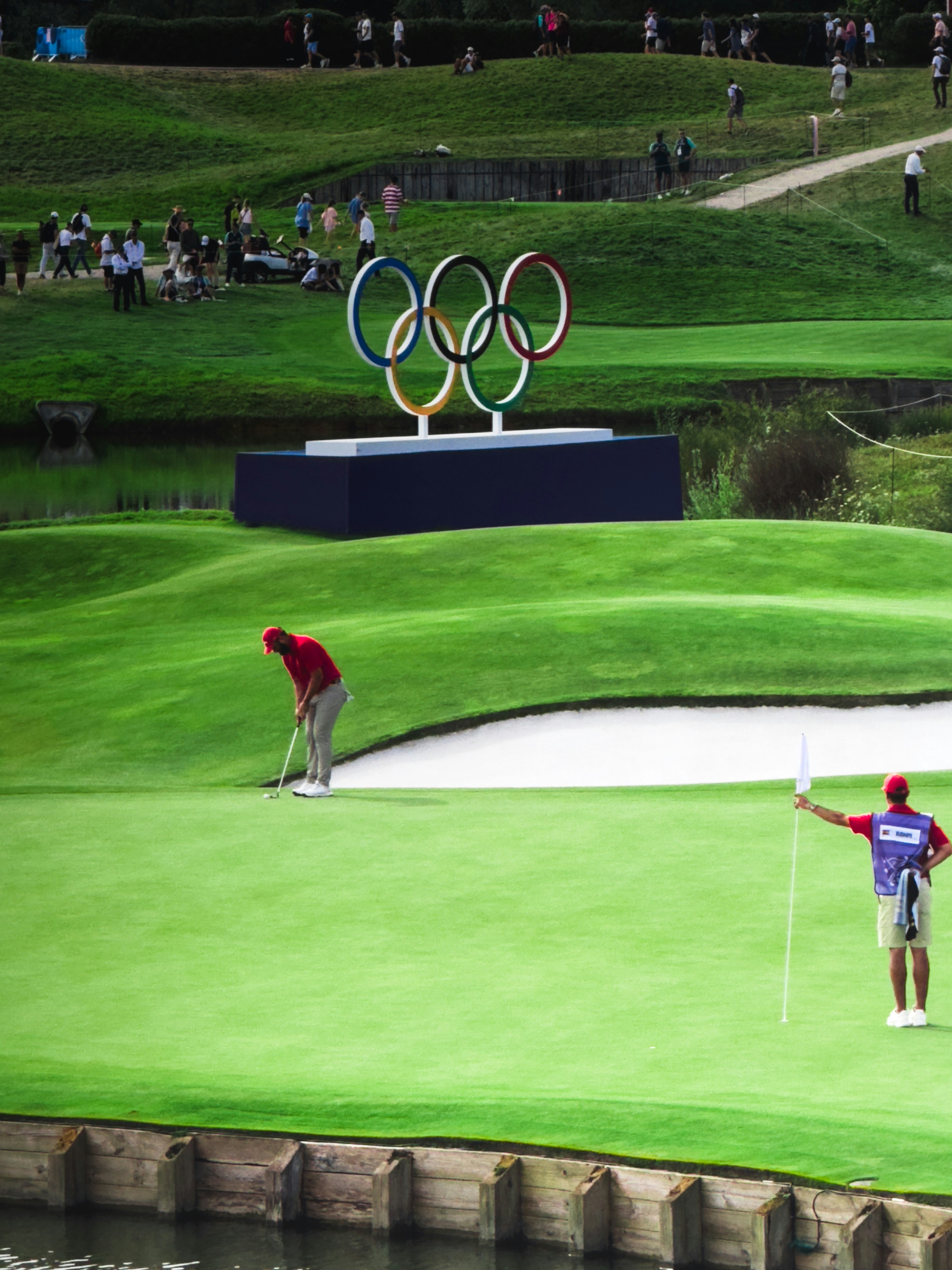 A man holding a golf club on a golf course