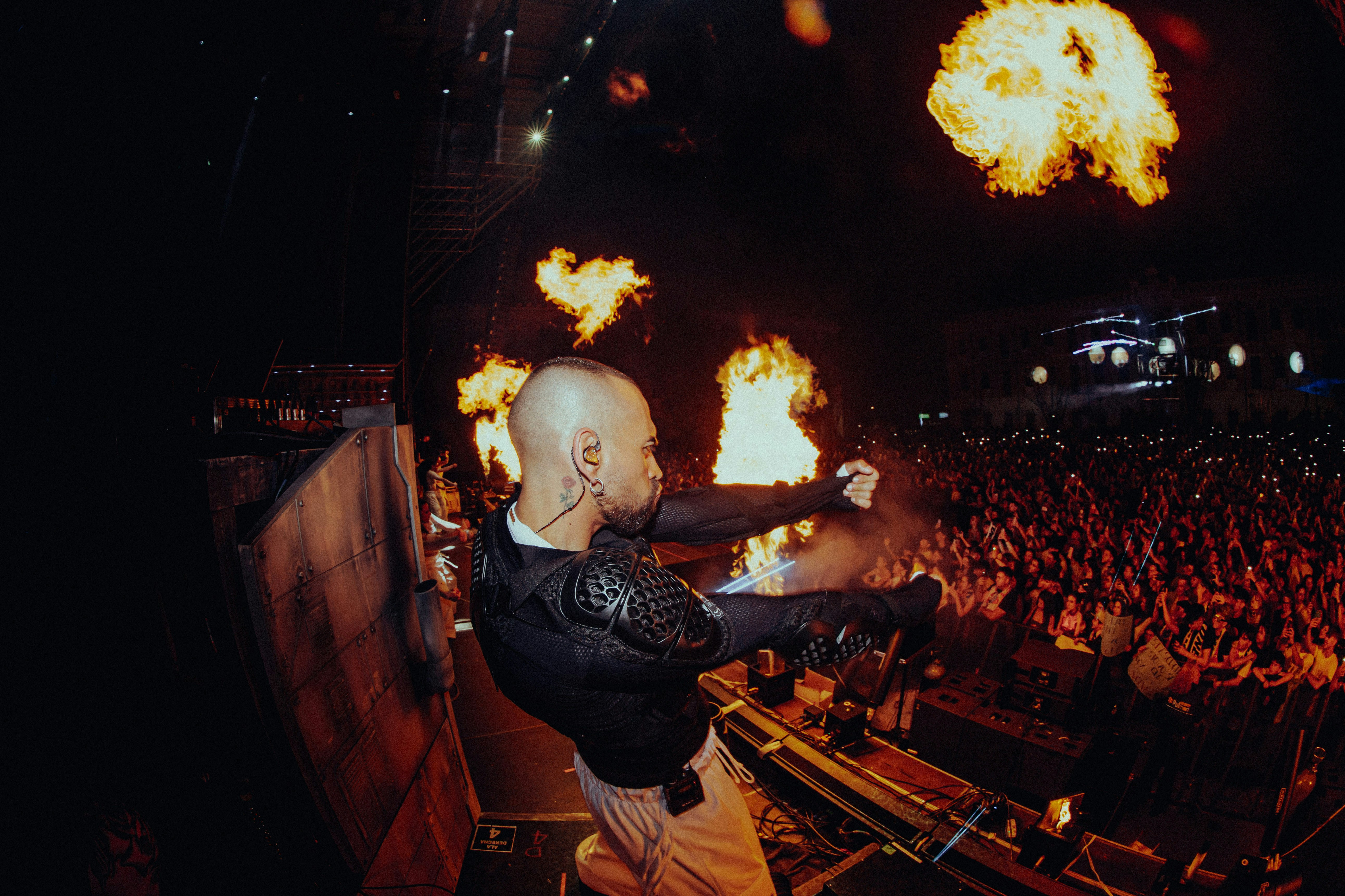 A man standing on top of a stage holding a microphone