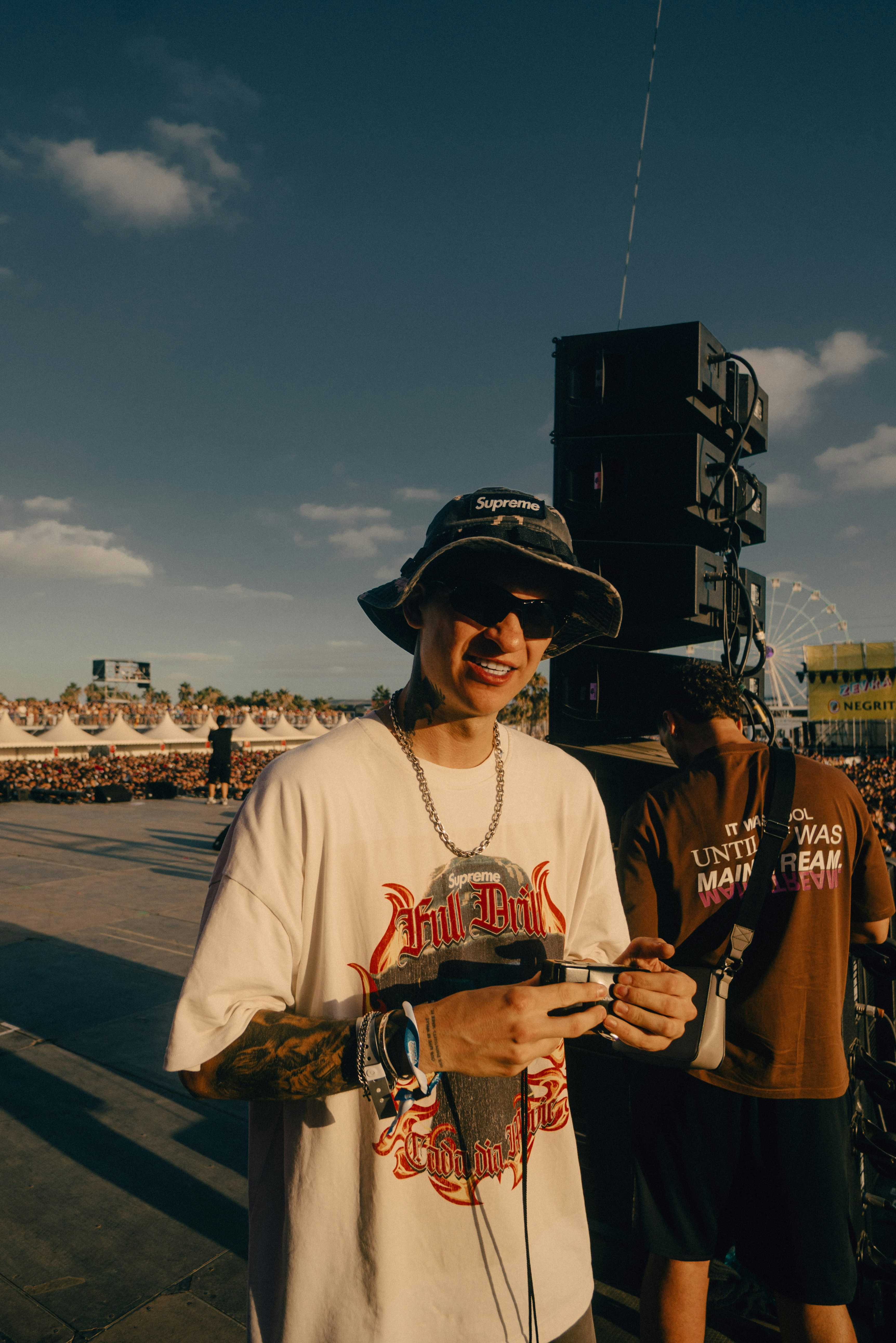 A man standing next to a crowd of people