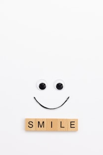 A smile made out of scrabbles on a white background