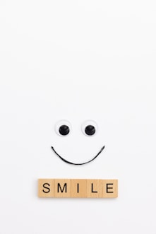 A smile made out of scrabbles on a white background