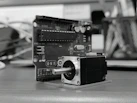 A camera sitting on top of a wooden table
