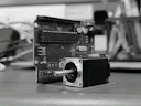 A camera sitting on top of a wooden table