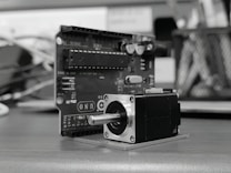 A camera sitting on top of a wooden table