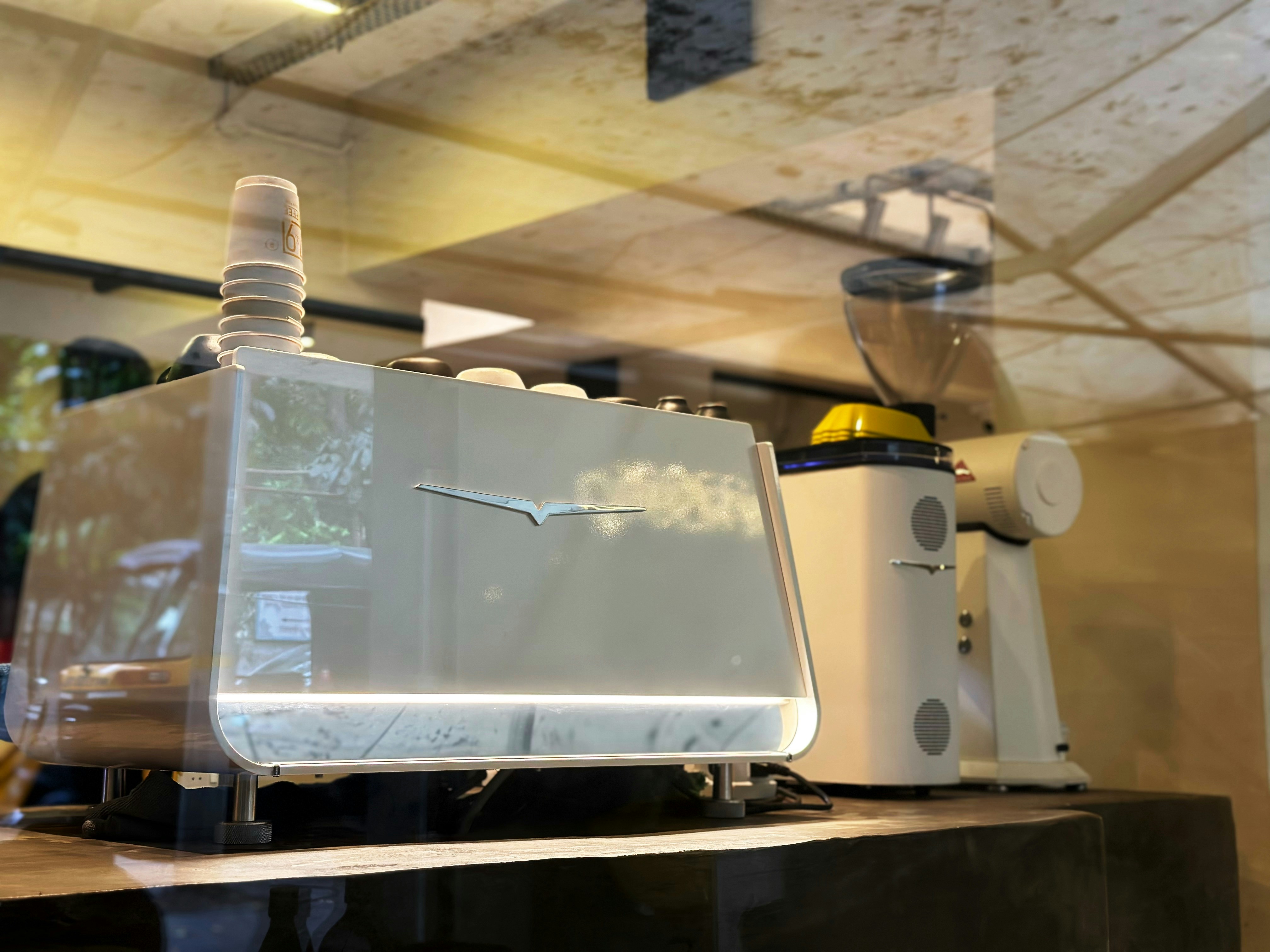 A white machine sitting on top of a counter