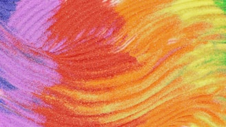 A close up of a multicolored tie dye background