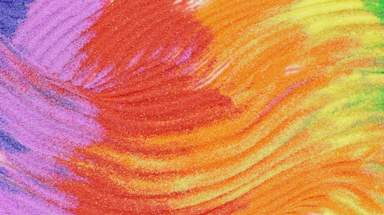 A close up of a multicolored tie dye background
