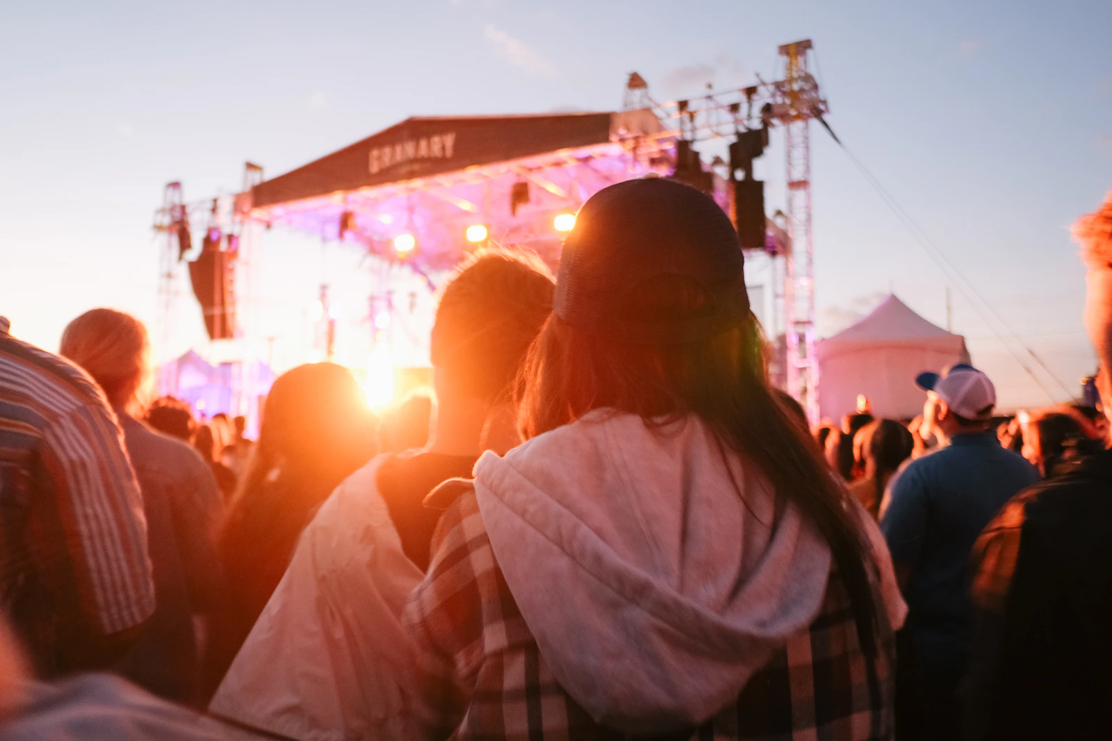 A crowd of people gathered at an outdoor community event