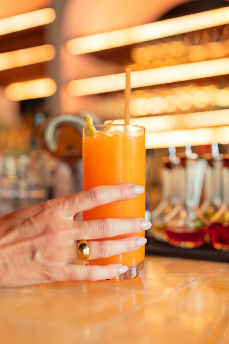 Person holding a glass