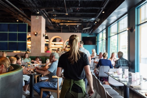 A busy restaurant dining room at lunchtime with guests at every table