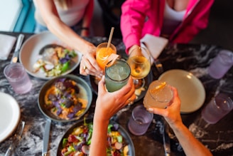 A group of people sitting around a table with drinks