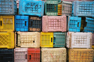 A pile of colorful crates stacked on top of each other