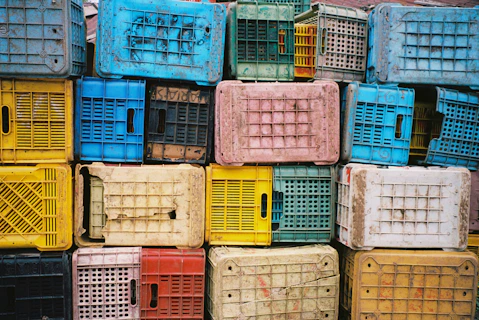 A pile of colorful crates stacked on top of each other