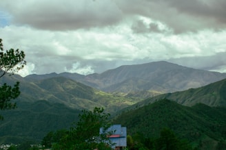 A view of a mountain range with a cloudy sky