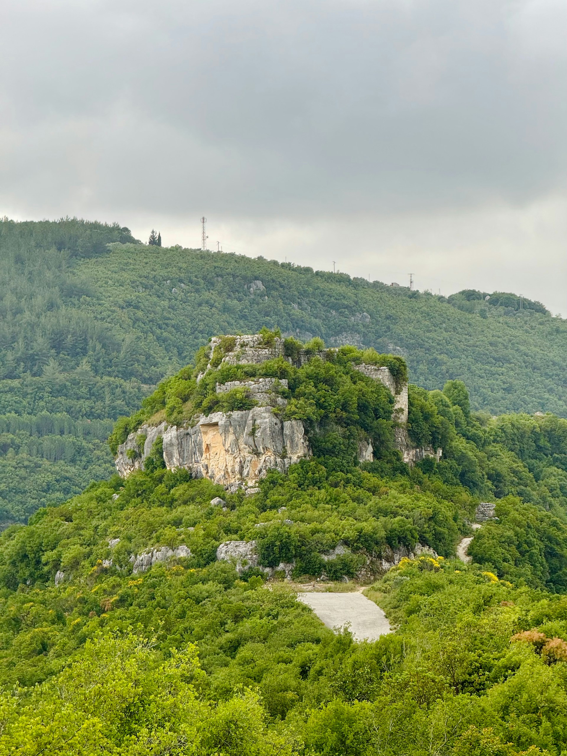A large hill with a castle on top of it