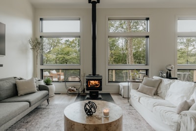 A living room filled with furniture and a fire place
