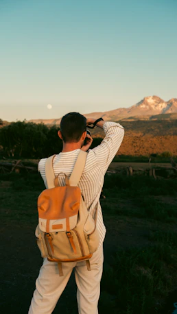 A man is taking a picture with his cell phone