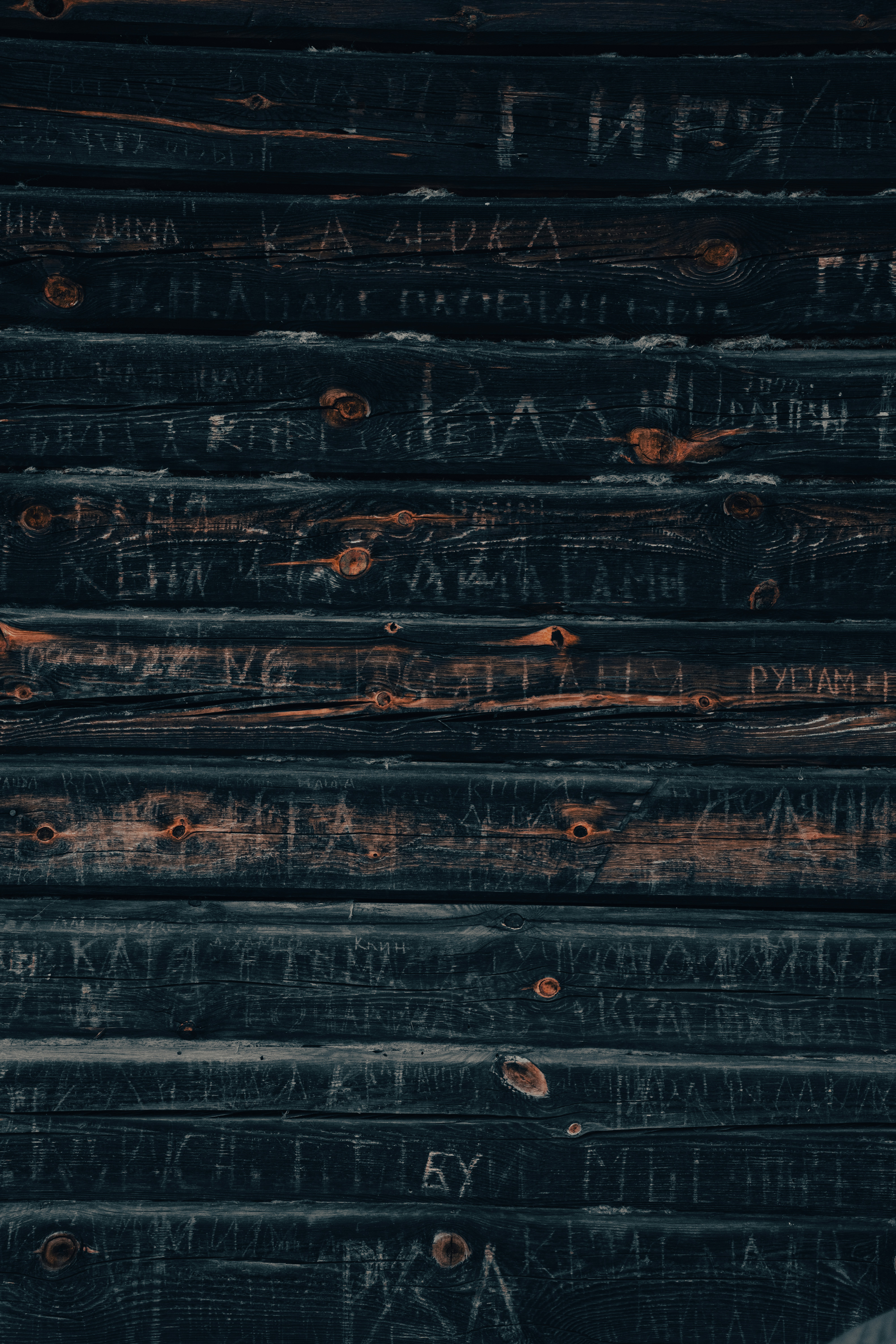 A stack of books with writing on them