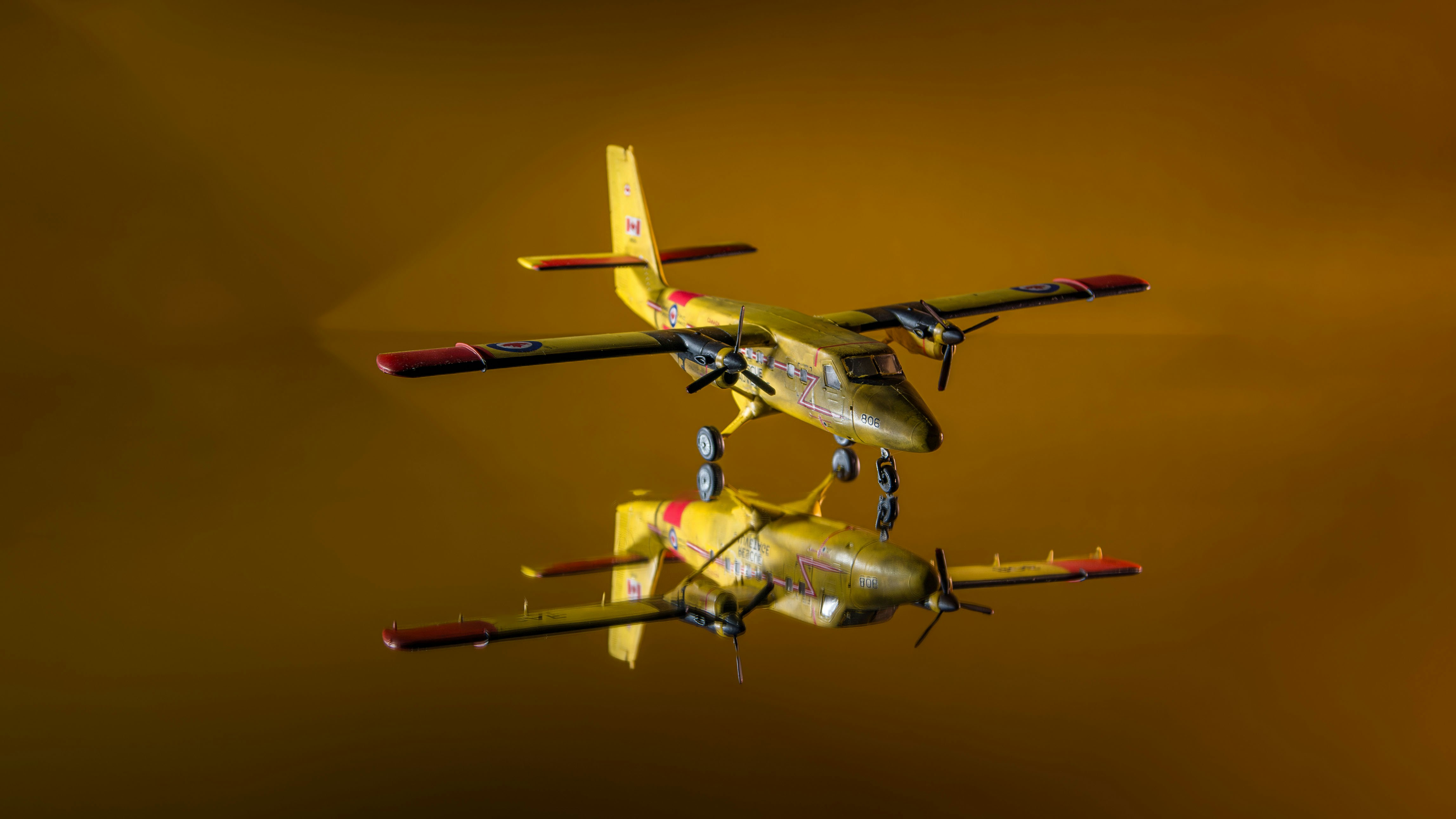 Two airplanes flying in the sky with a yellow background, 