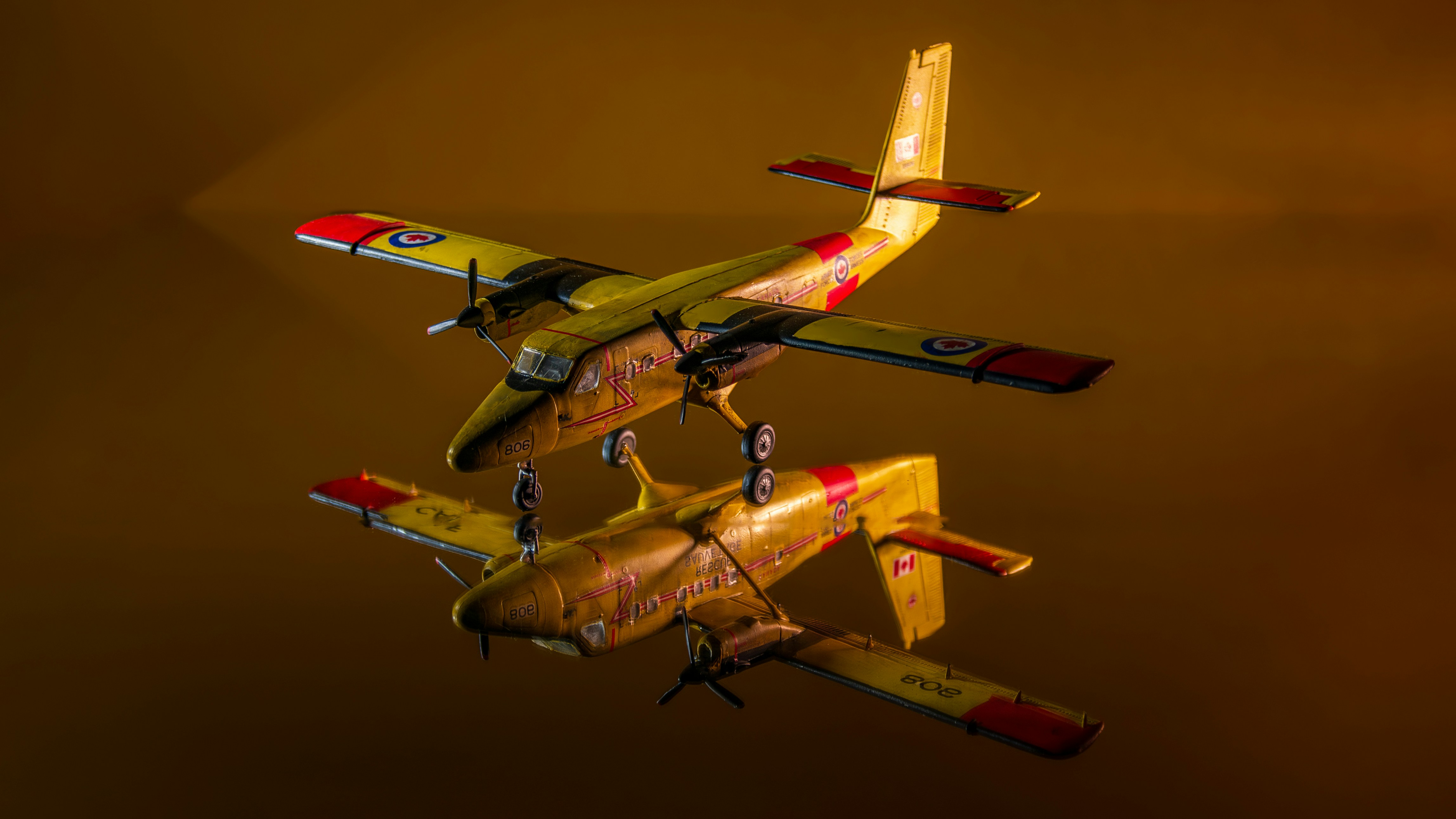 A couple of airplanes flying through a cloudy sky