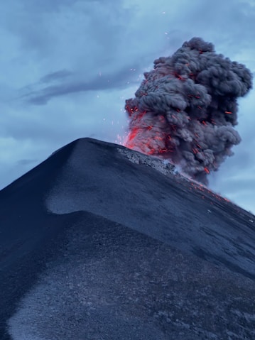 A volcano erupts smoke as it erupts into the sky