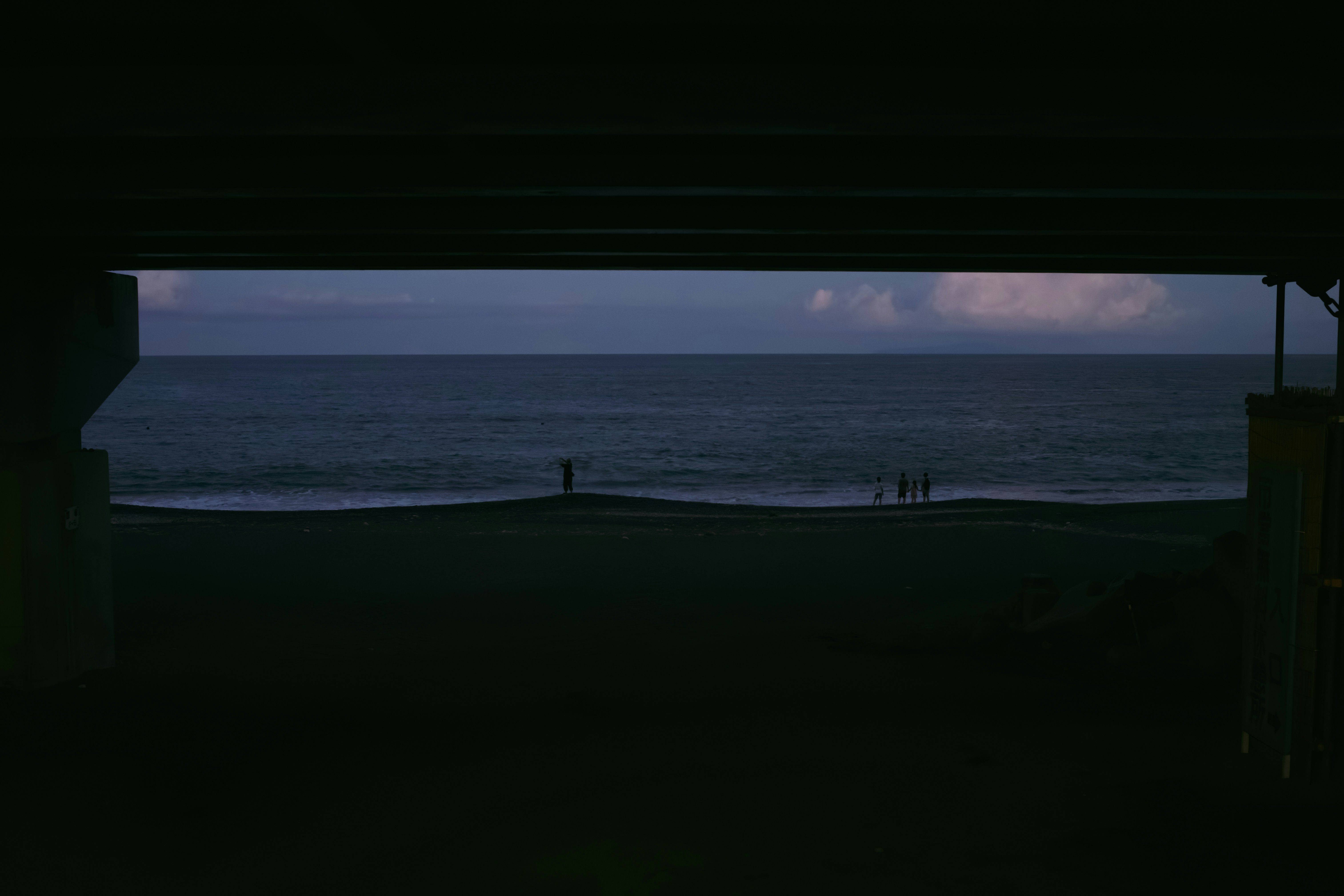 A view of the ocean from inside a building
