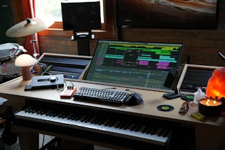 A desk with a keyboard and a monitor