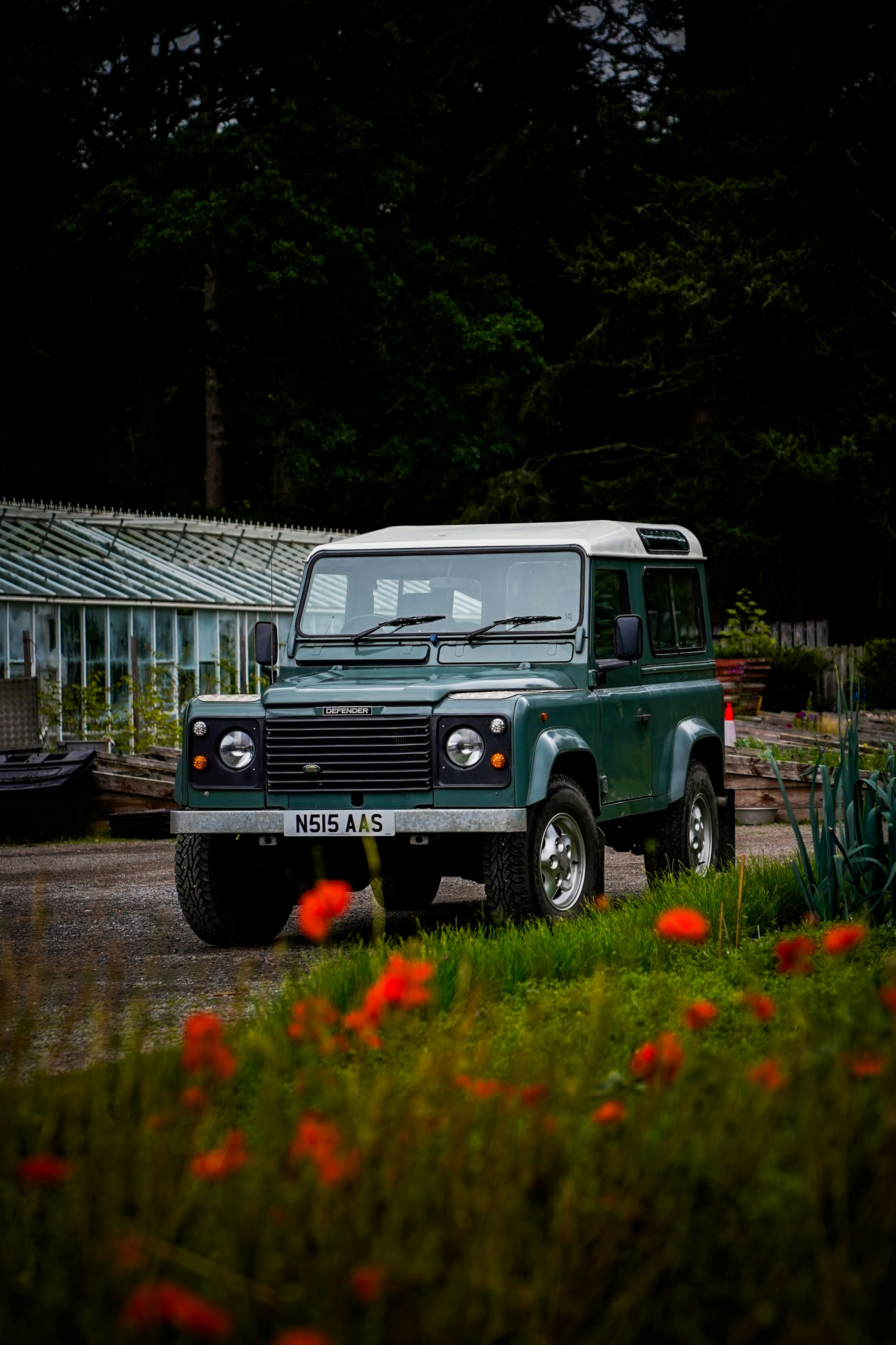 A green land rover parked in front of a greenhouse photo – Free Travel ...