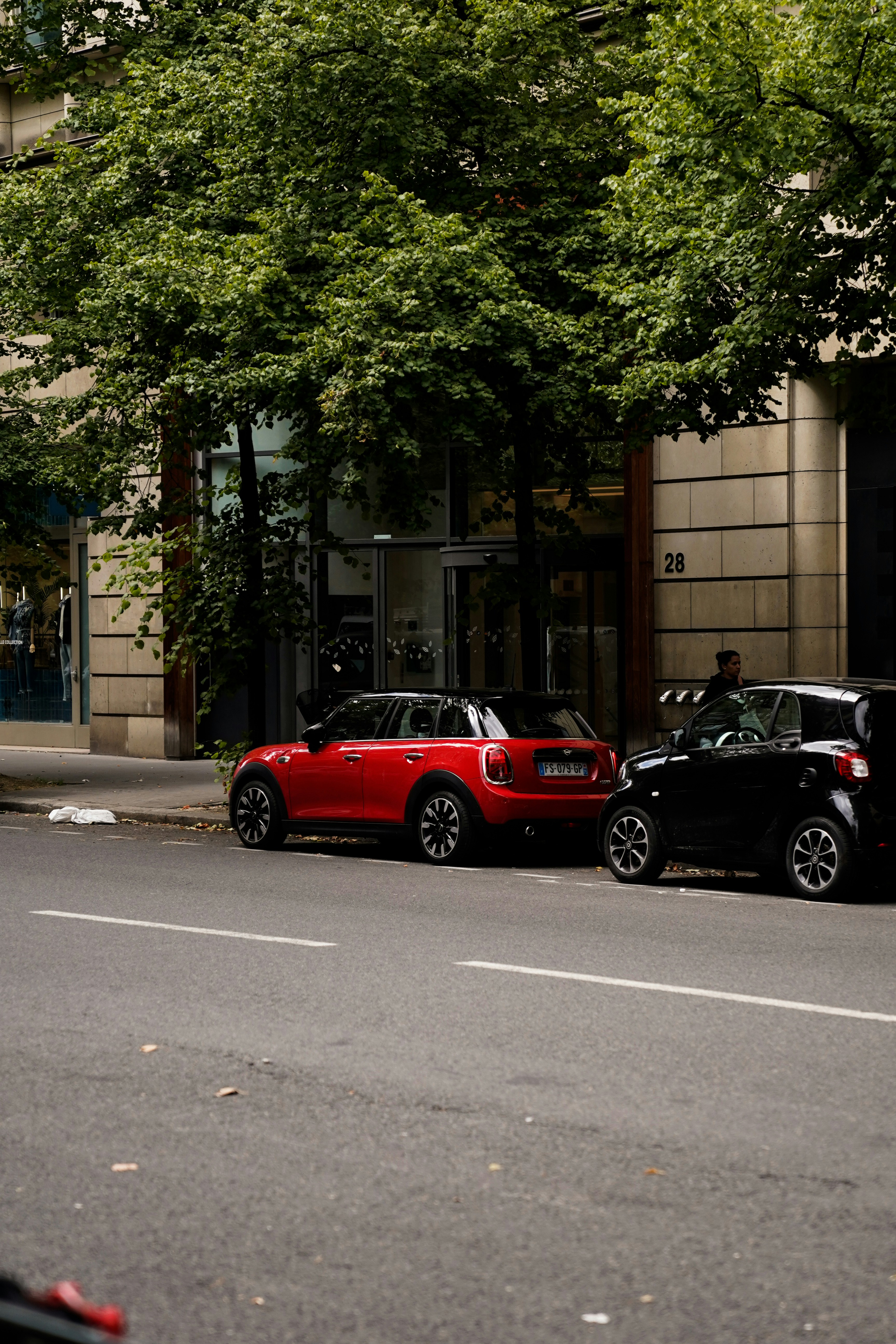 A couple of cars parked on the side of a road