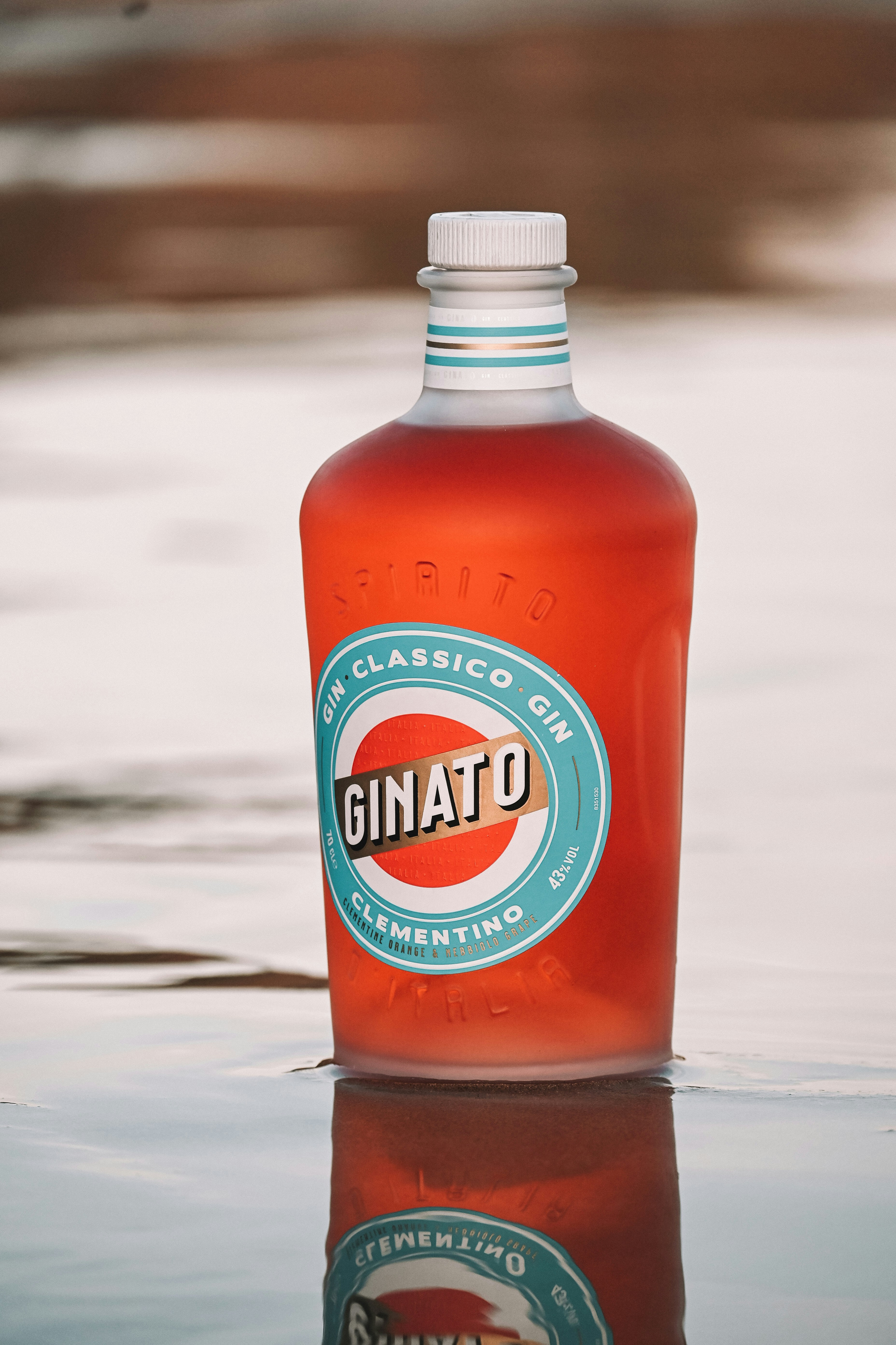 A bottle of ginato sitting in the water
