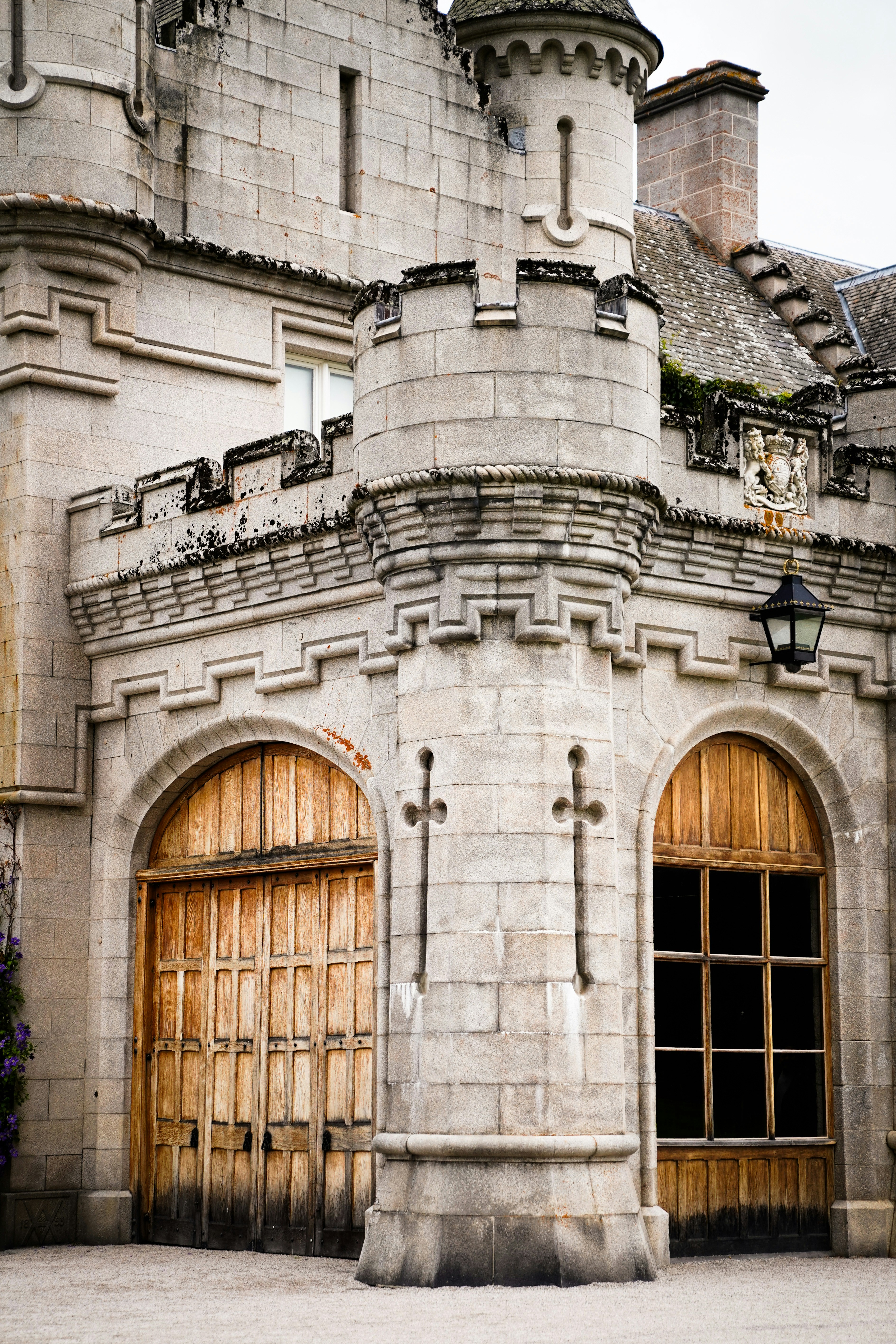 A large castle like building with a clock on it's side