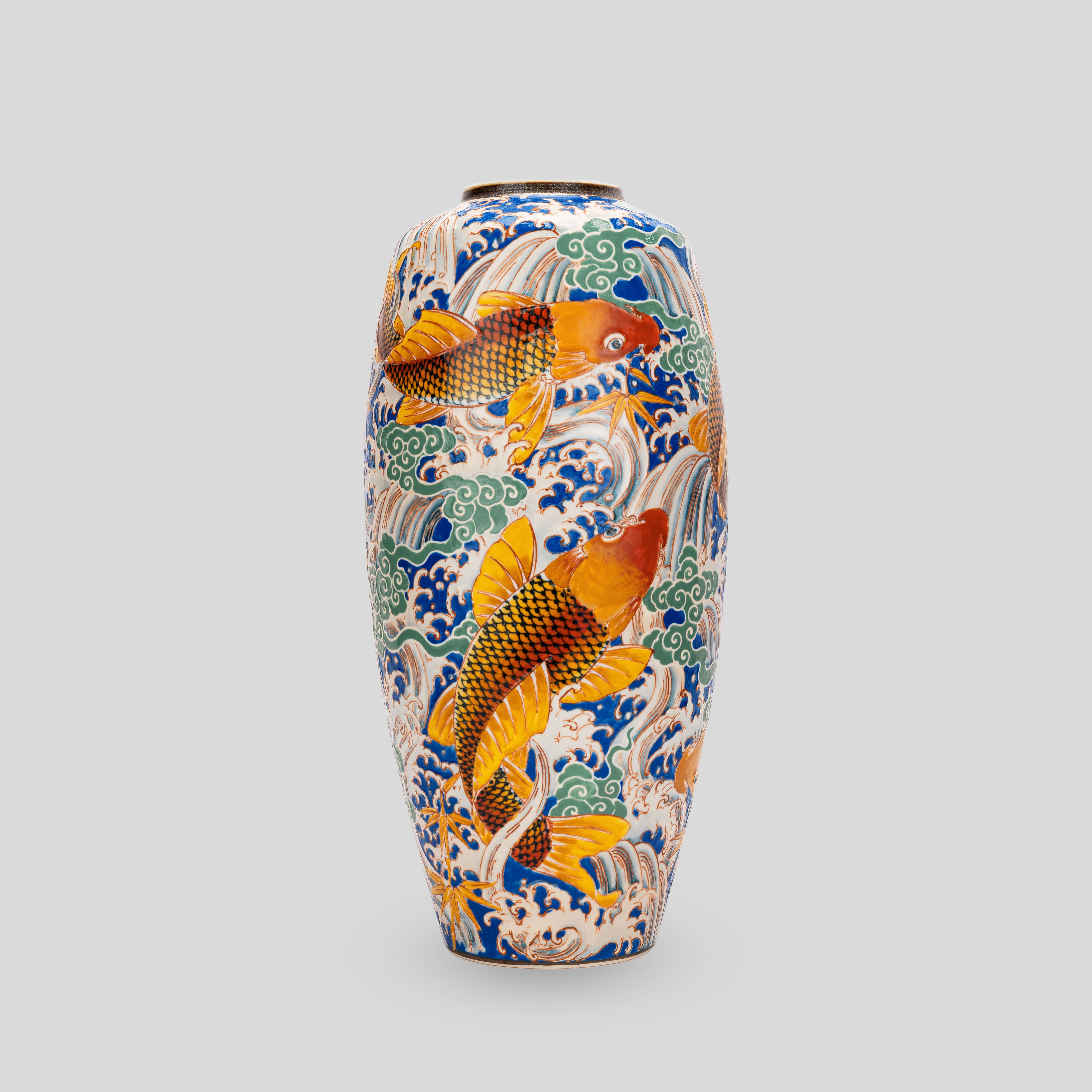 A vase with fish painted on it