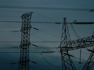 A group of power lines in the middle of the night
