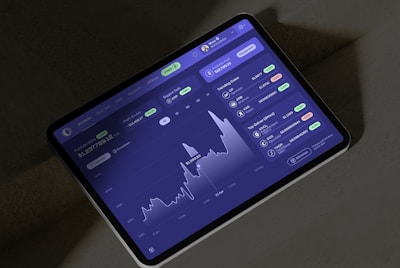 A cell phone displaying a stock chart on the screen