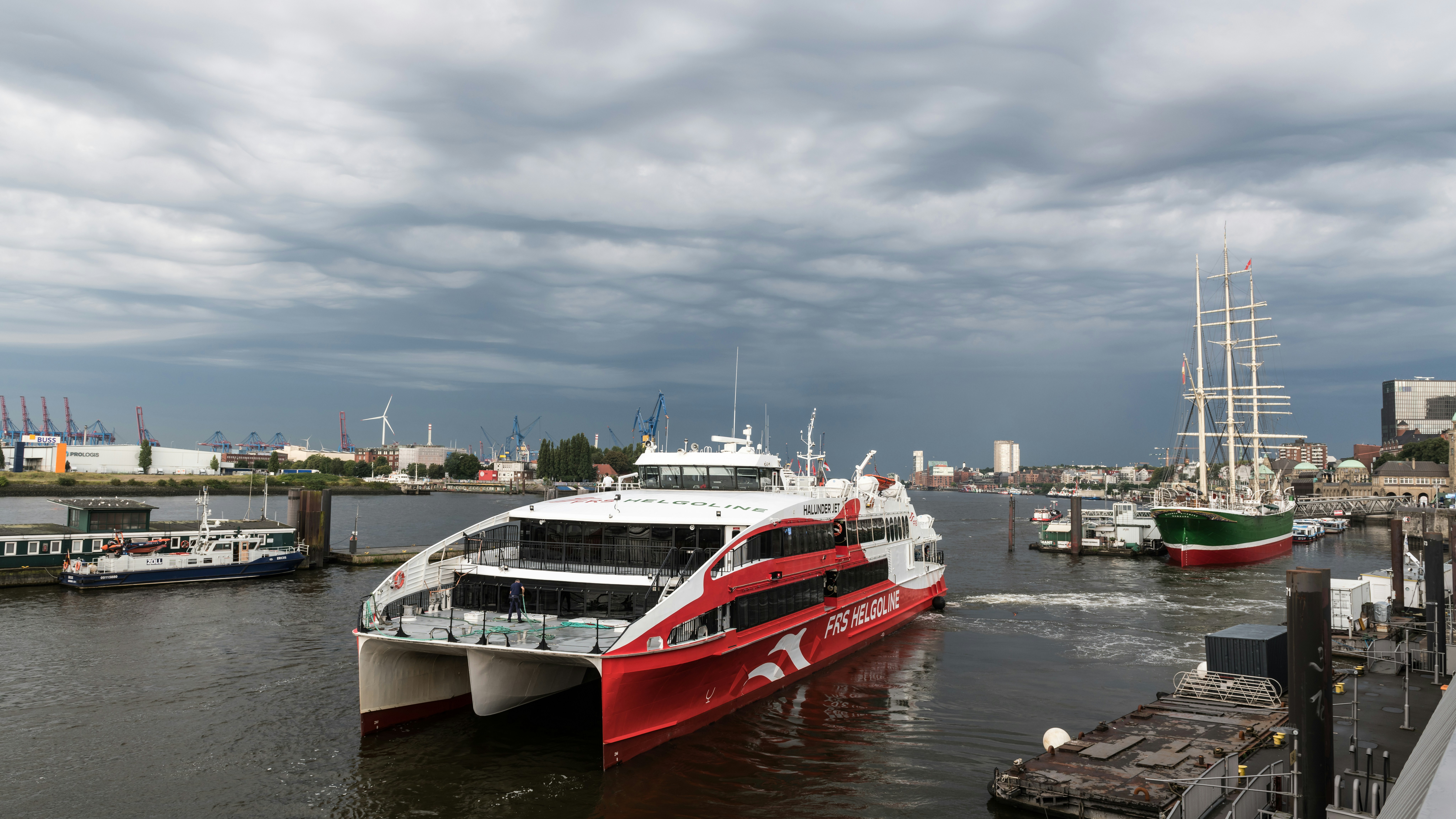 A large white and red boat in the water