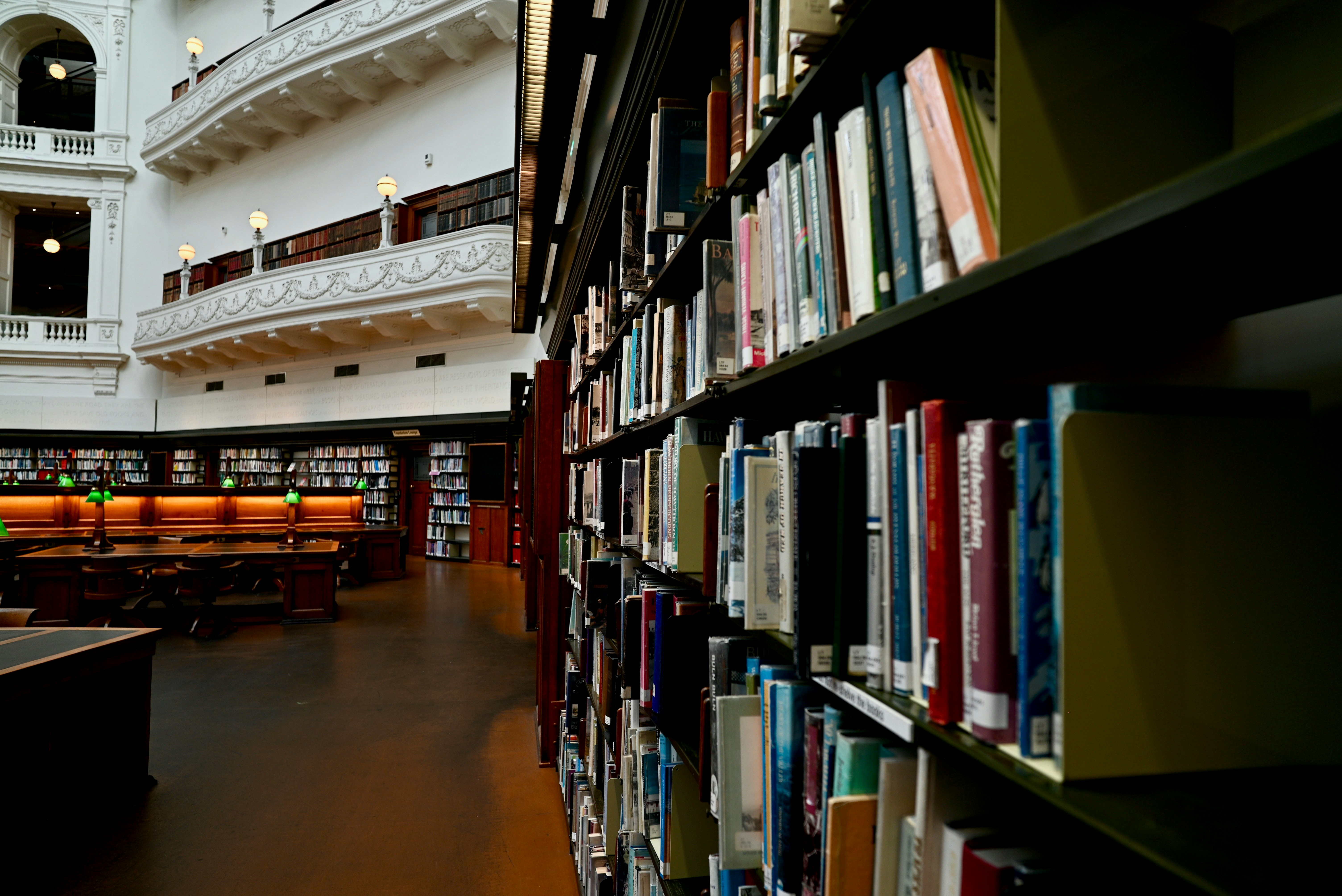 A library filled with lots of books and lots of tables
