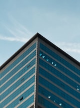 A tall building with a sky in the background