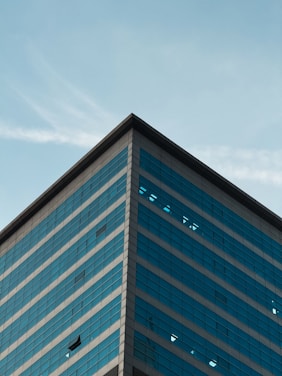 A tall building with a sky in the background